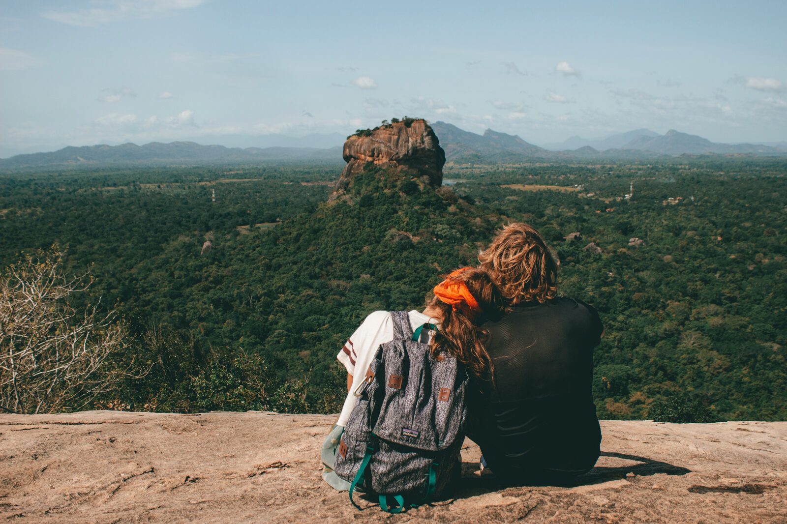 West Virginia couple sitting on a lookout point taking in the view