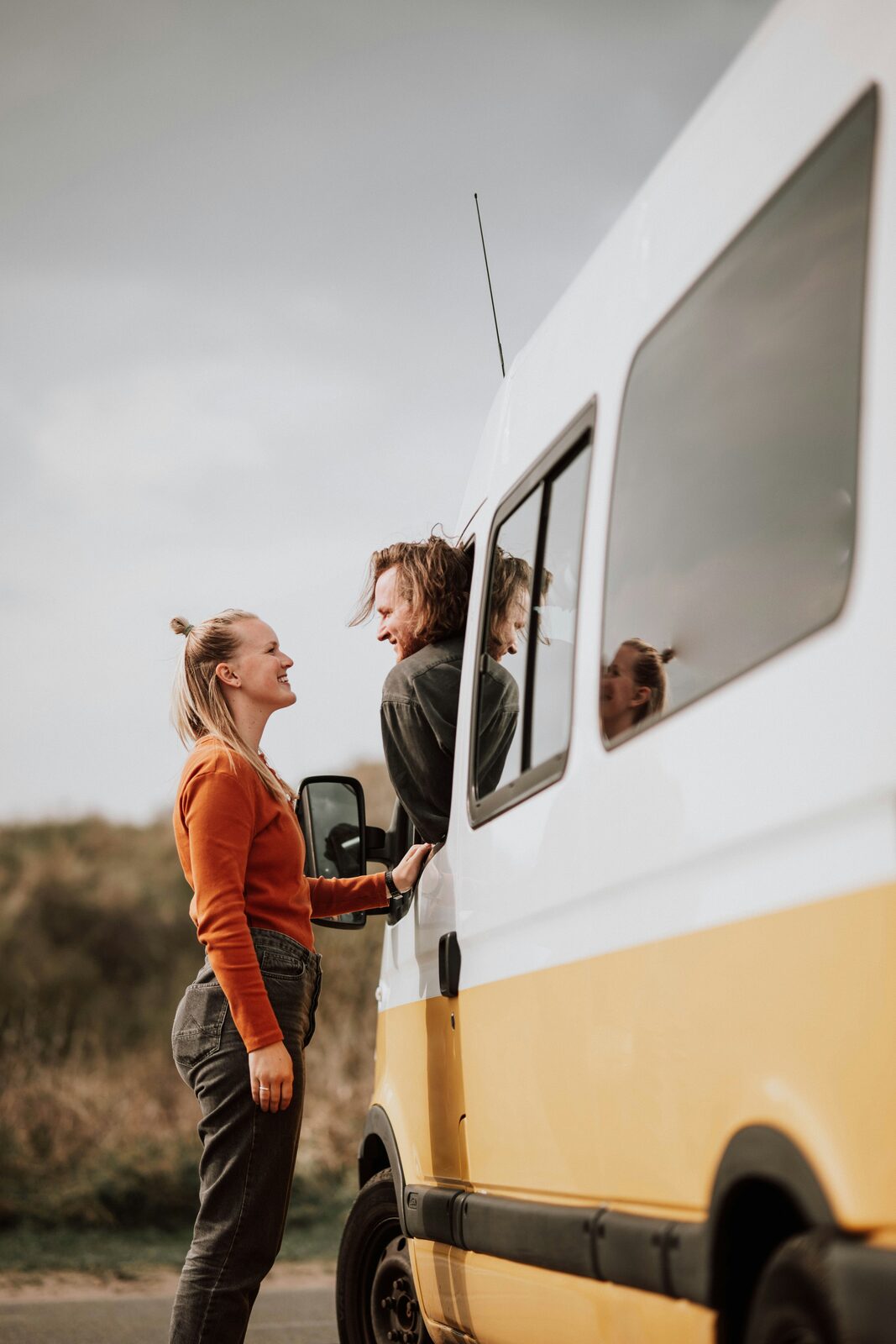 West Virginia couple talking through a camper van window about marital property and alimony in their prenuptial agreement