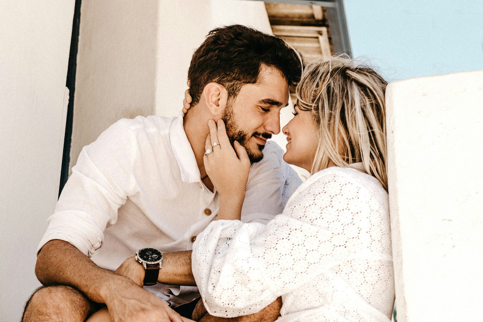Close-up of an engaged Georgia couple with the engagement ring visible as they prepare to build their prenup