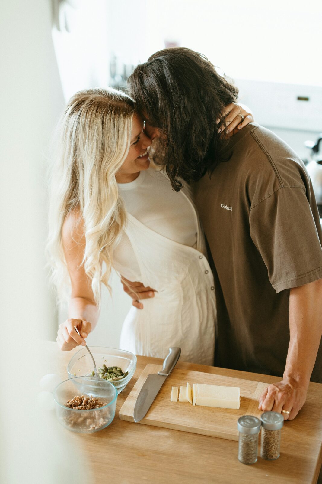 Engaged Nevada couple cooking together at home while planning their finances