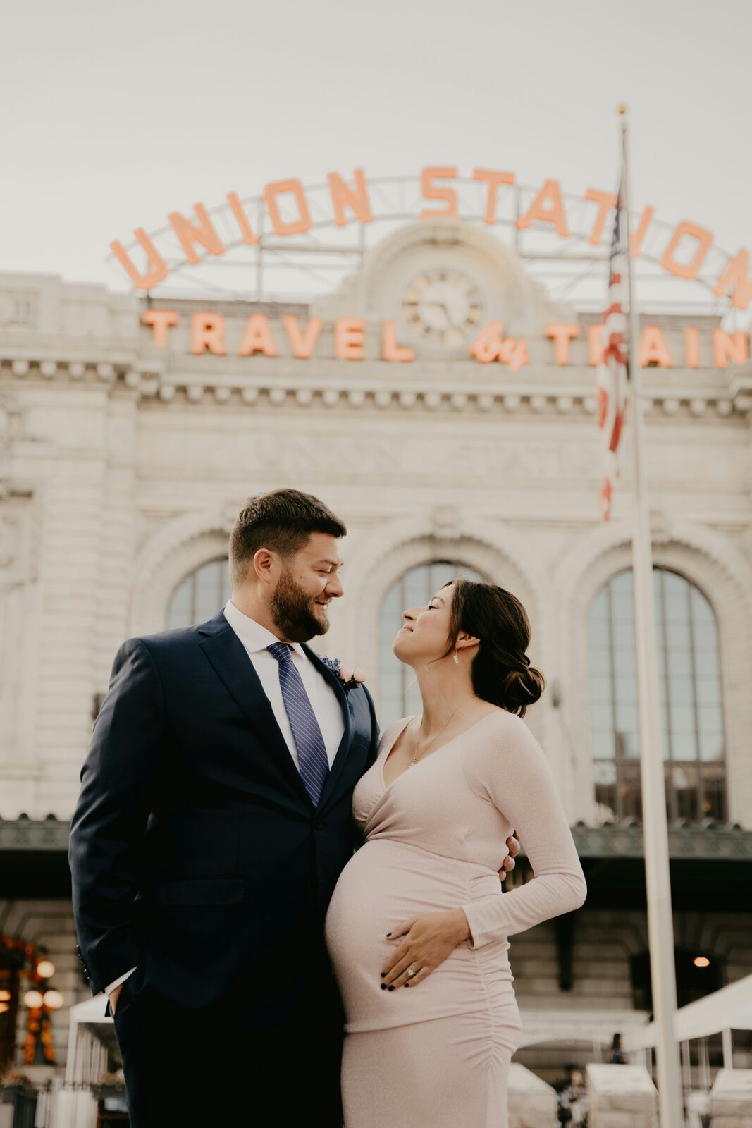 Expecting Colorado couple in a maternity portrait at Denver Union Station