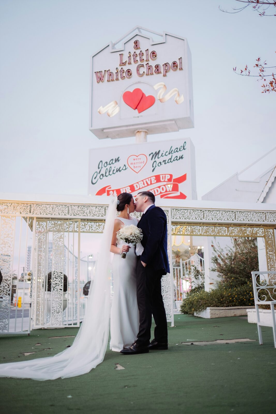 Bride and groom kissing at the Little White Chapel in Las Vegas, Nevada