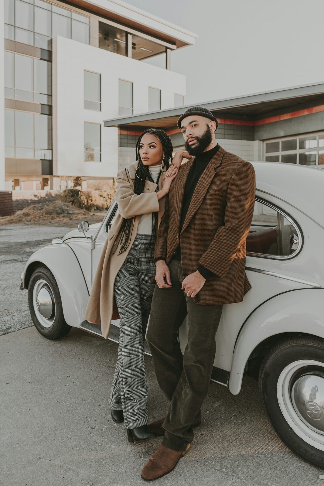 Virginia couple by a vintage VW Beetle on a crisp fall day in a camel coat and tweed blazer
