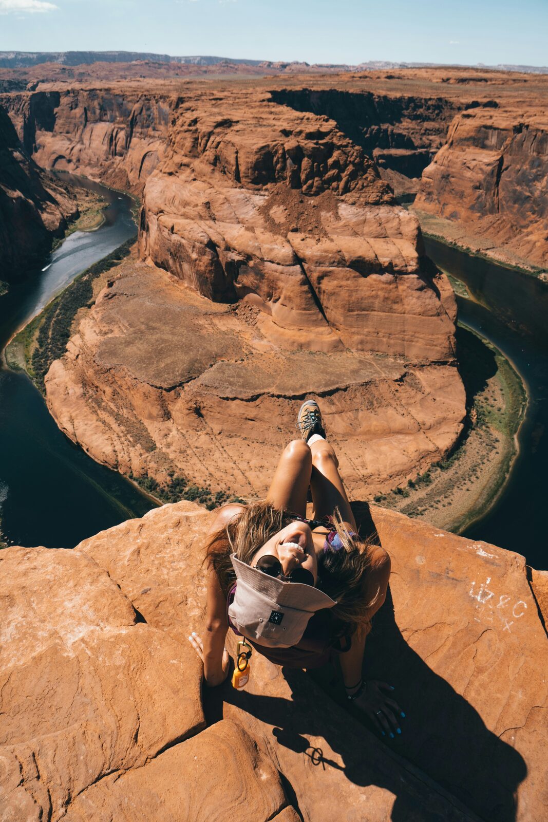 Woman at Horseshoe Bend in Arizona overlooking the Colorado River while considering financial disclosure for her prenup