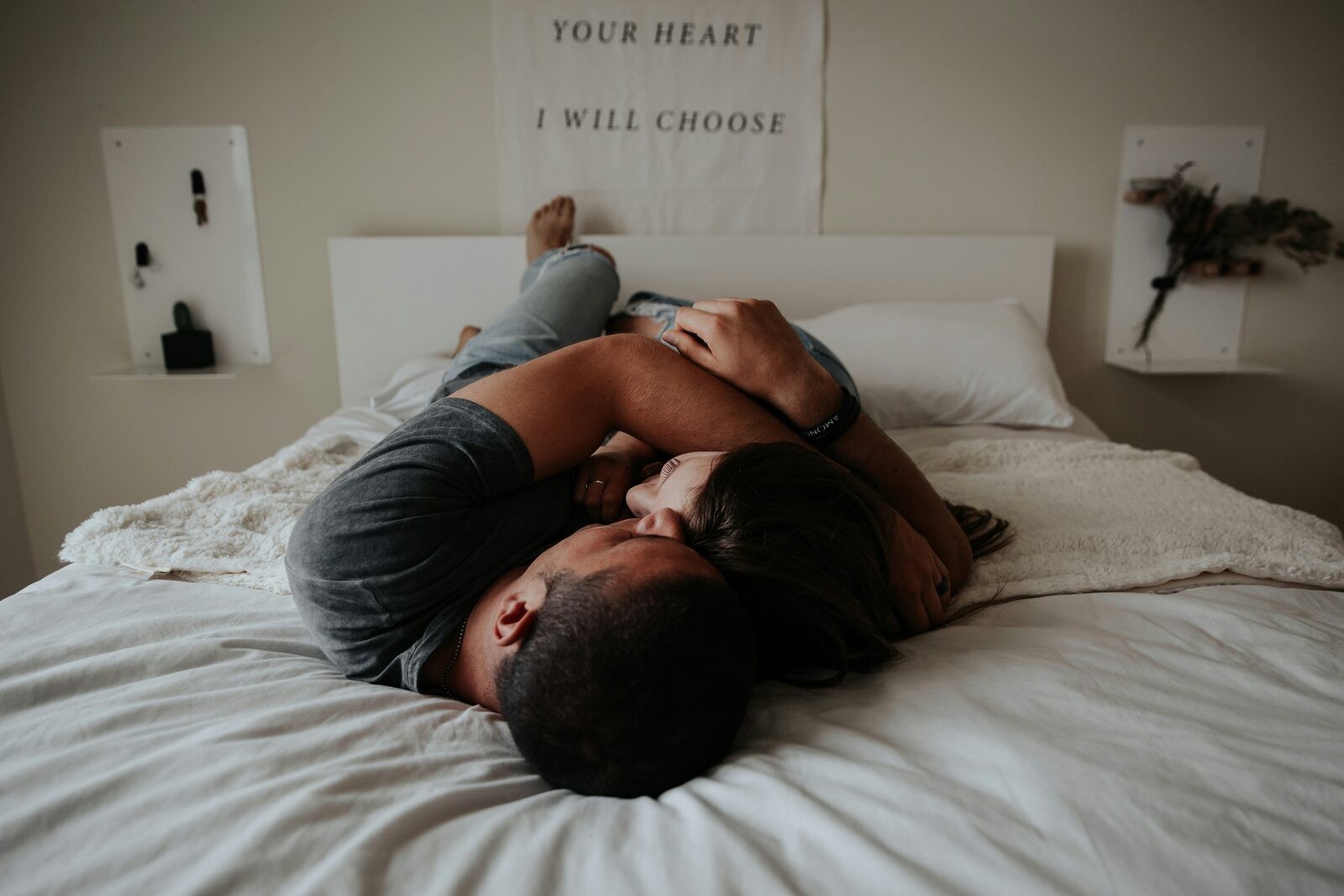 Connecticut couple cozy in bed at home in an intimate portrait