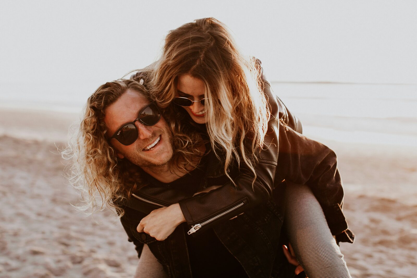 Ohio couple laughing together at golden hour after completing their prenup