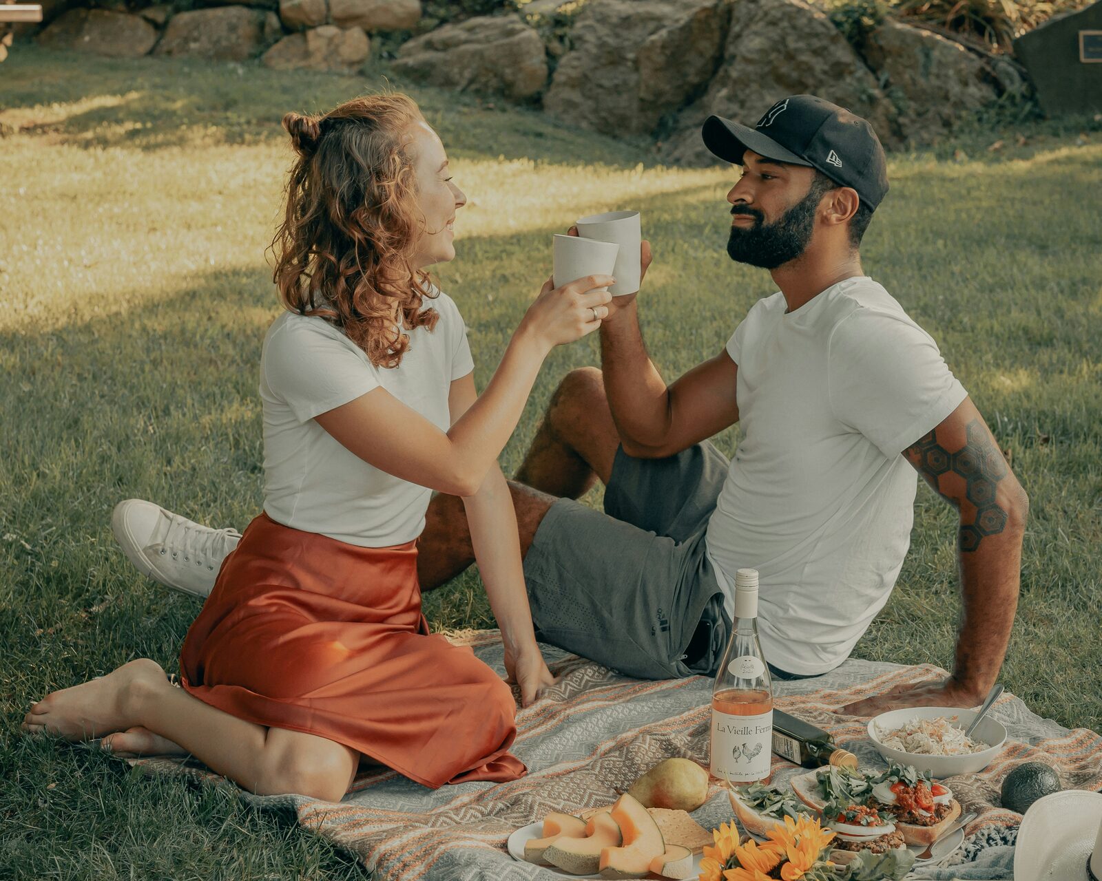 Oklahoma couple sharing a picnic in the park, talking through how to get their prenup done
