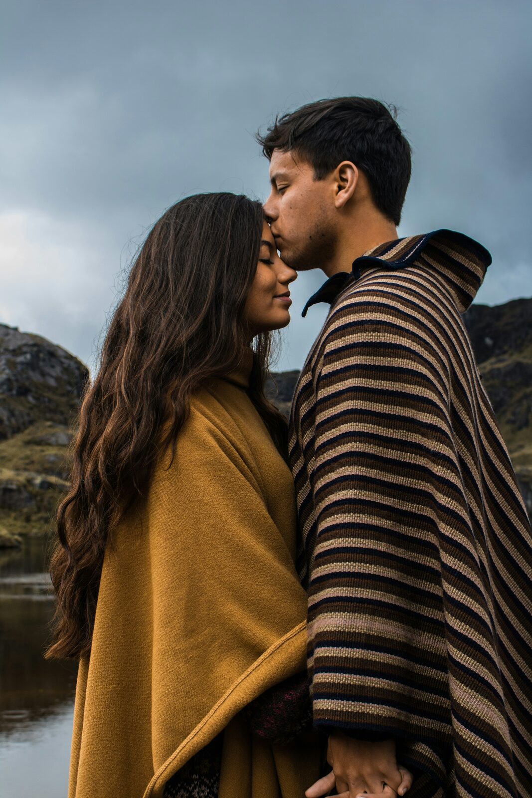 Ohio couple sharing a calm forehead kiss after a stress-free prenup process