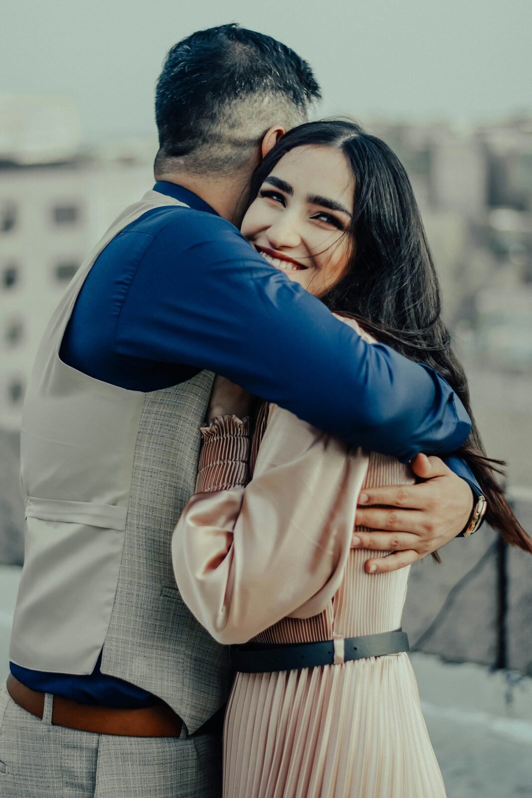 South Carolina couple embracing on a rooftop while planning their prenuptial agreement