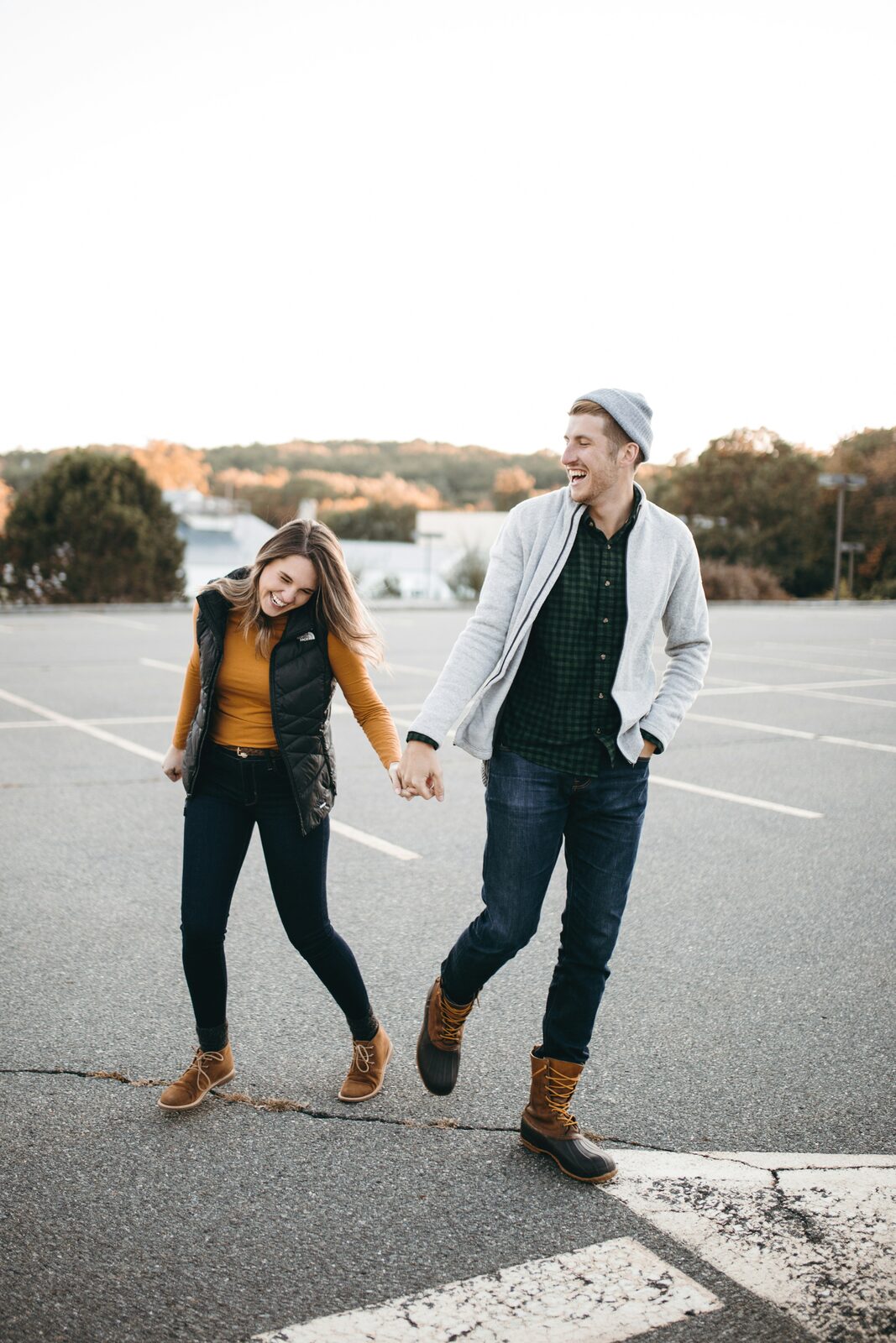 Tennessee couple laughing together in fall layers, reflecting the range of assets a prenup can protect