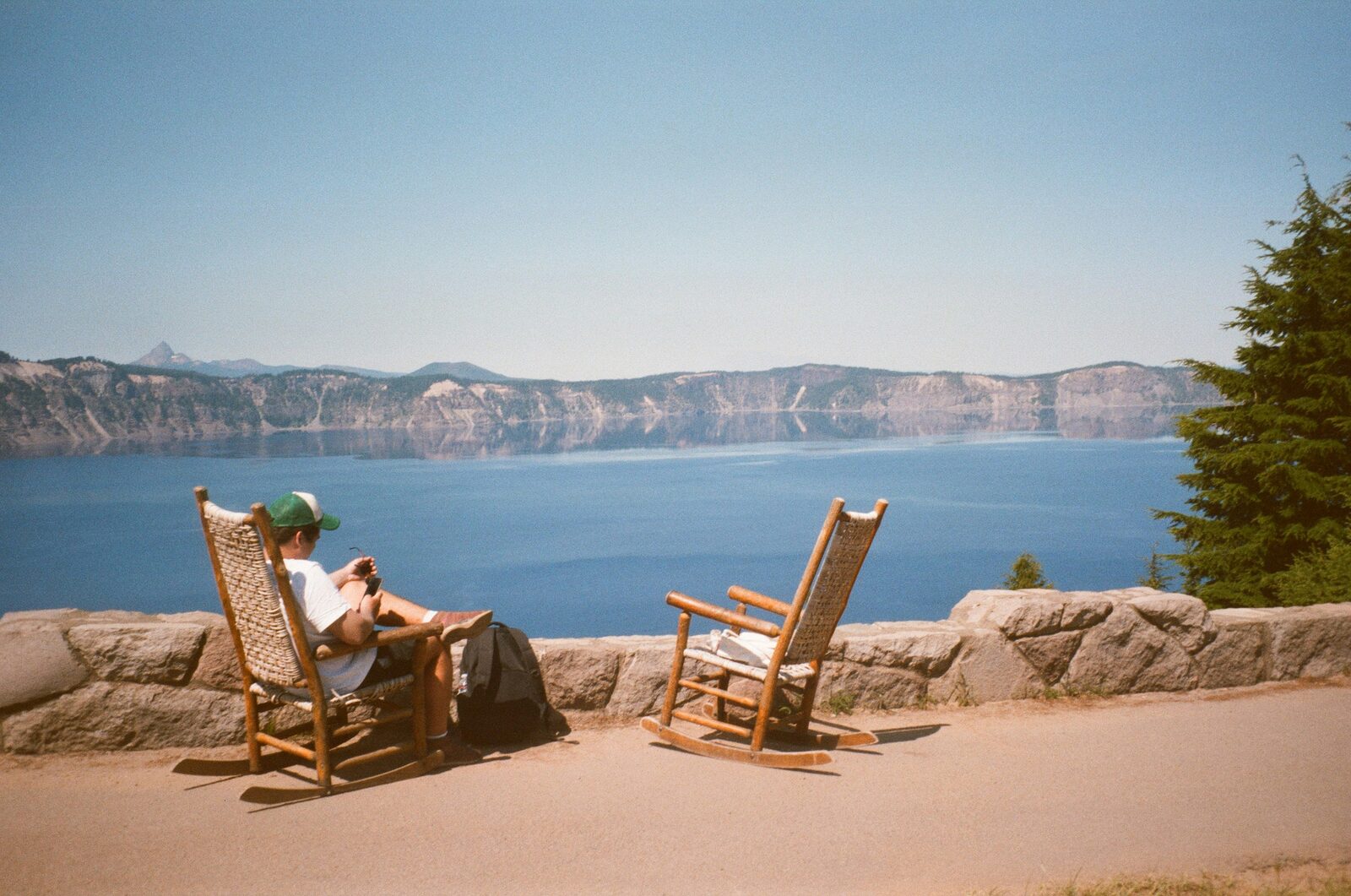 Rocking chairs on the lodge terrace overlooking Crater Lake in Oregon