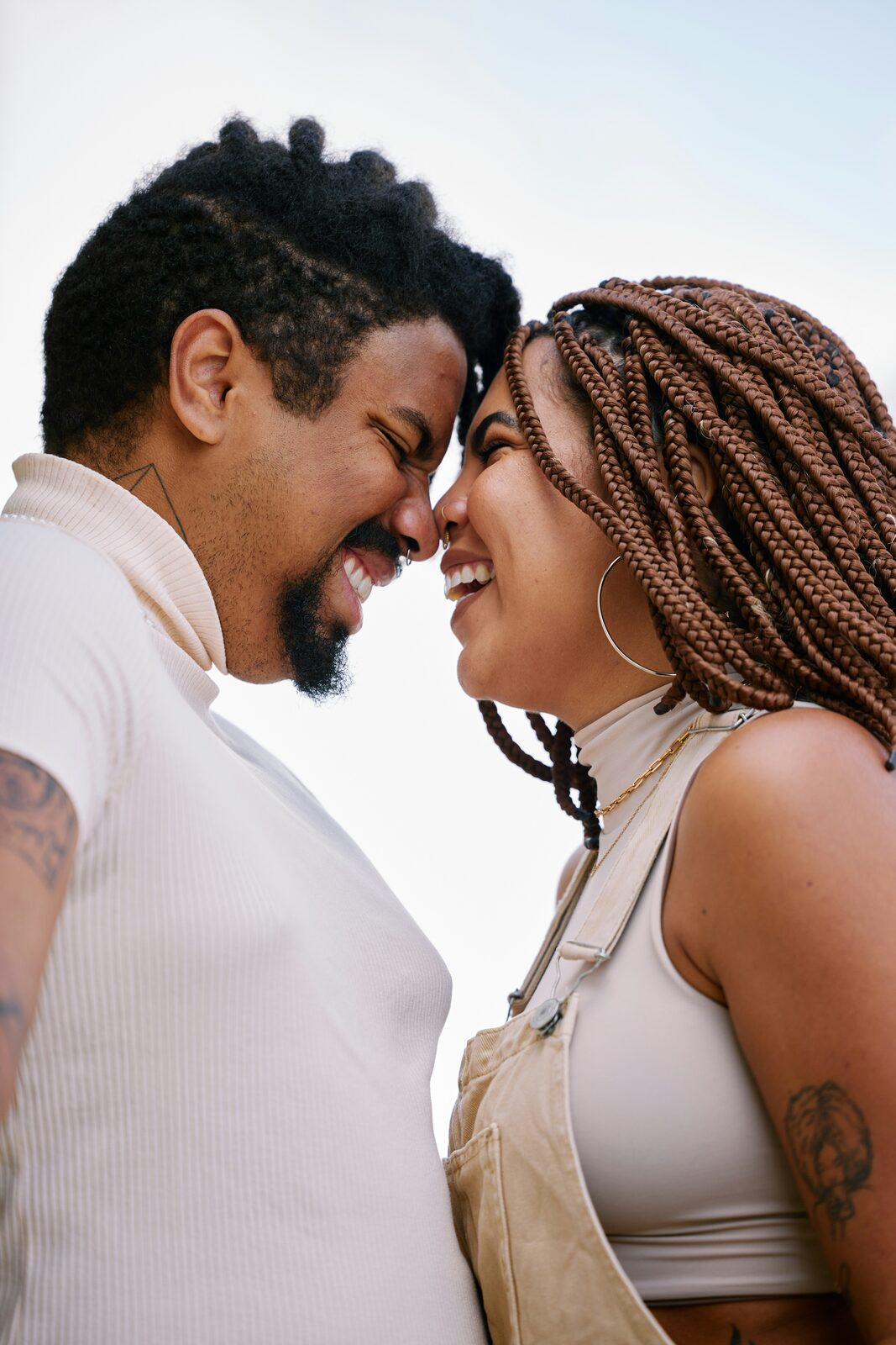 Engaged Louisiana couple touching foreheads and smiling, protected with a HelloPrenup prenuptial agreement