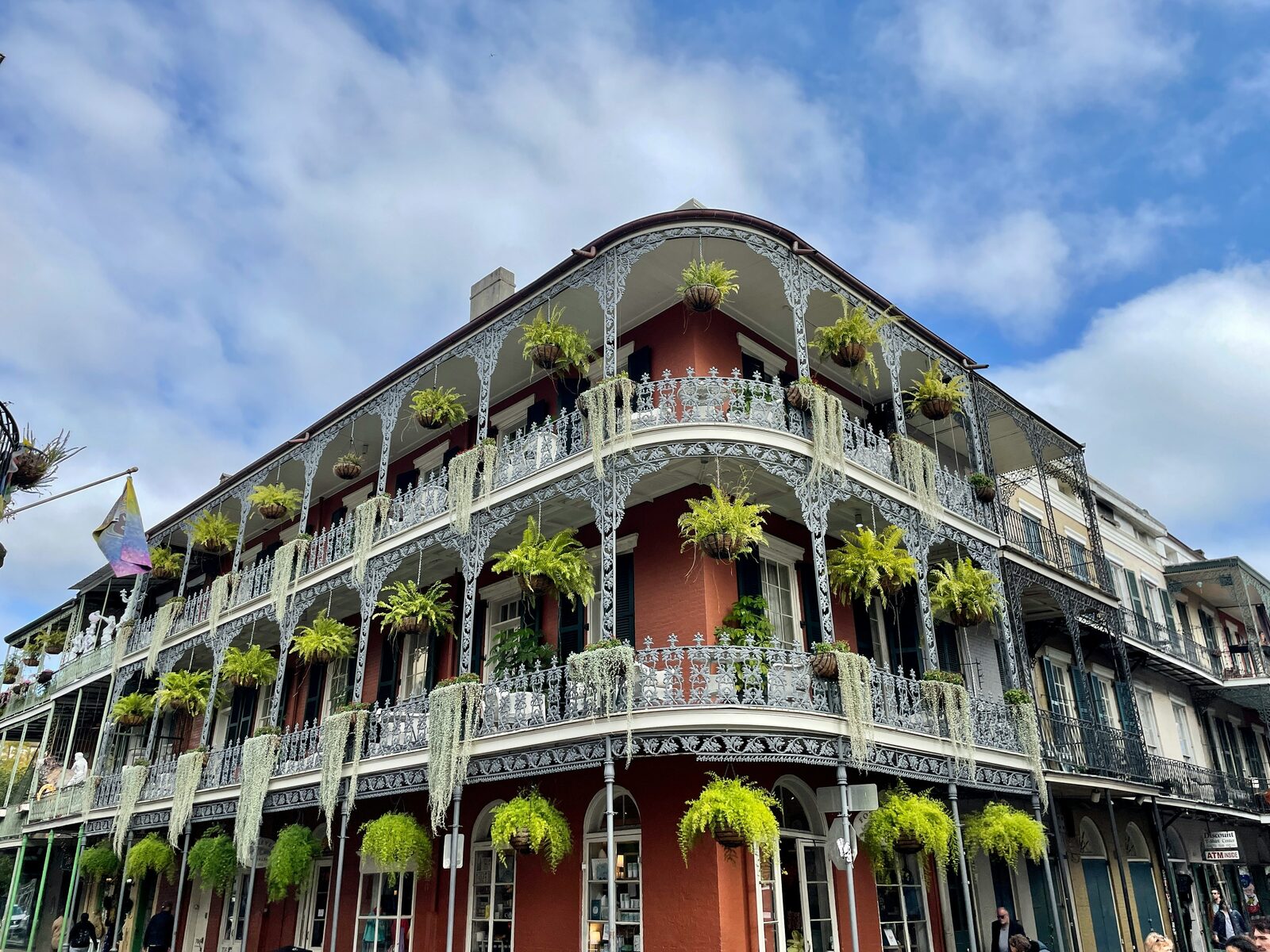 The LaBranche House in the New Orleans French Quarter, with wrought iron balconies and hanging ferns